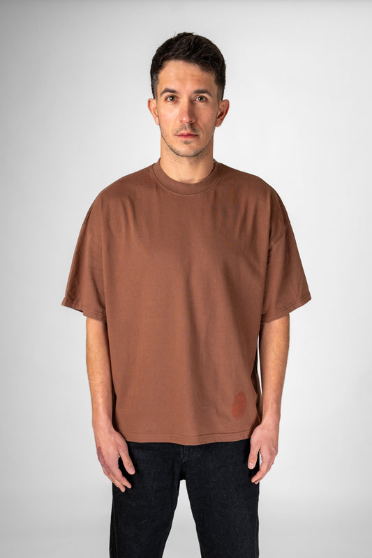 Model wearing vintage brown Identity T-Shirt front view