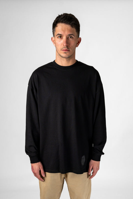 Model wearing black Identity Long Sleeve T-Shirt front view