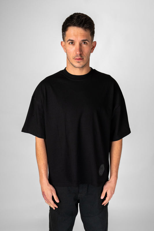 Model wearing black Identity T-Shirt front view