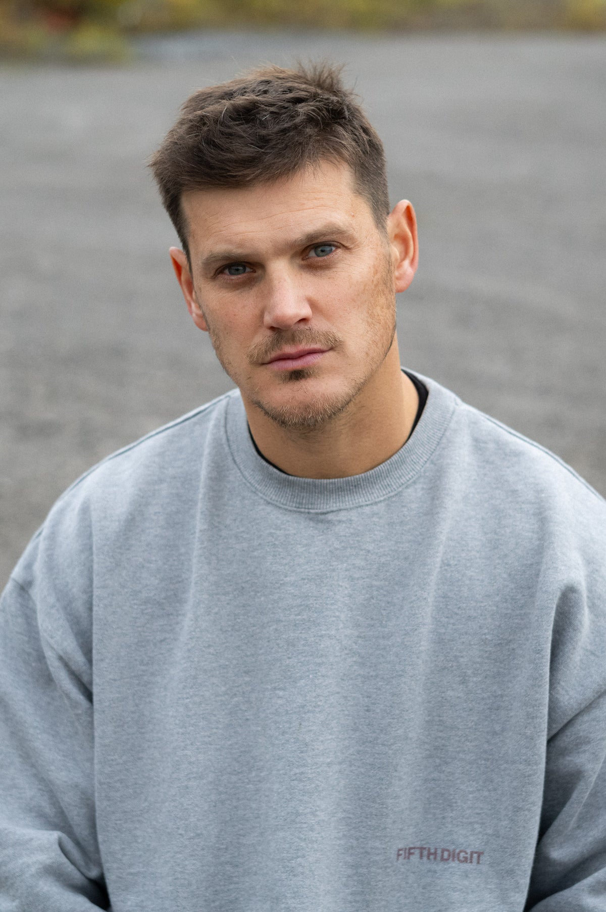 Model wearing Fifth Digit Arch 460gsm crewneck in grey marl, front view