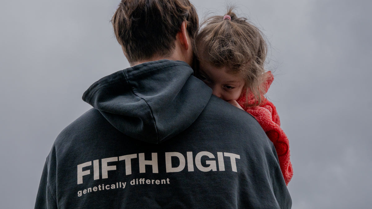 James Harris wearing the Fifth Digit Frame hoodie, back view