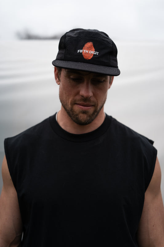Model wearing black Identity Cap front view